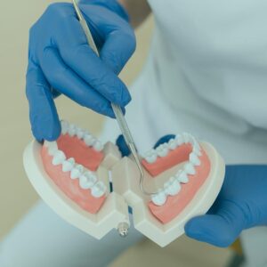 Dentist explaining what cosmetic dentistry is to a patient.